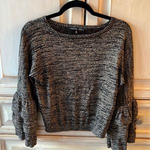 Black and gold statement sleeve sweater